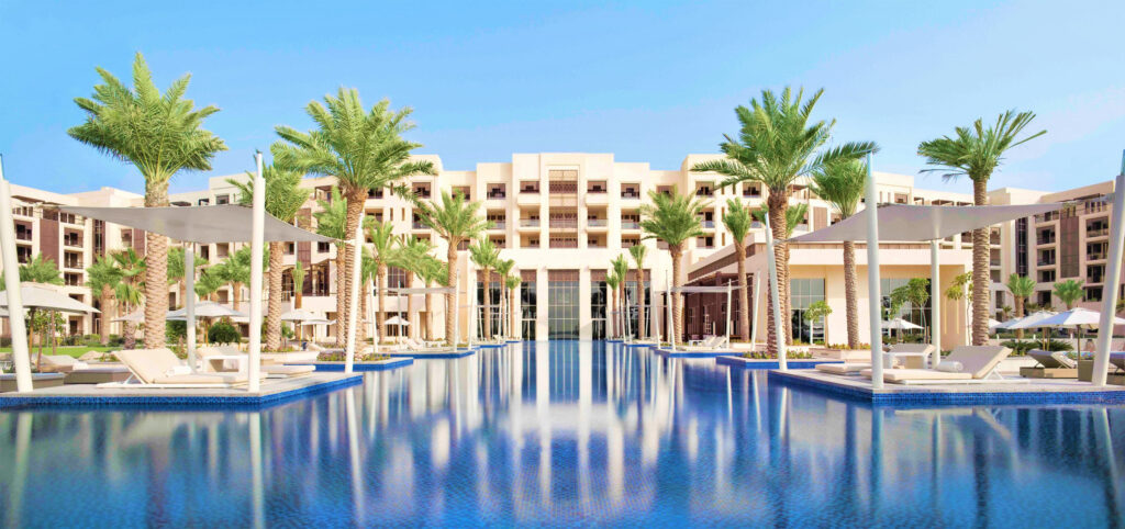 Exterior of Park Hyatt Abu Dhabi with outdoor pool and loungers