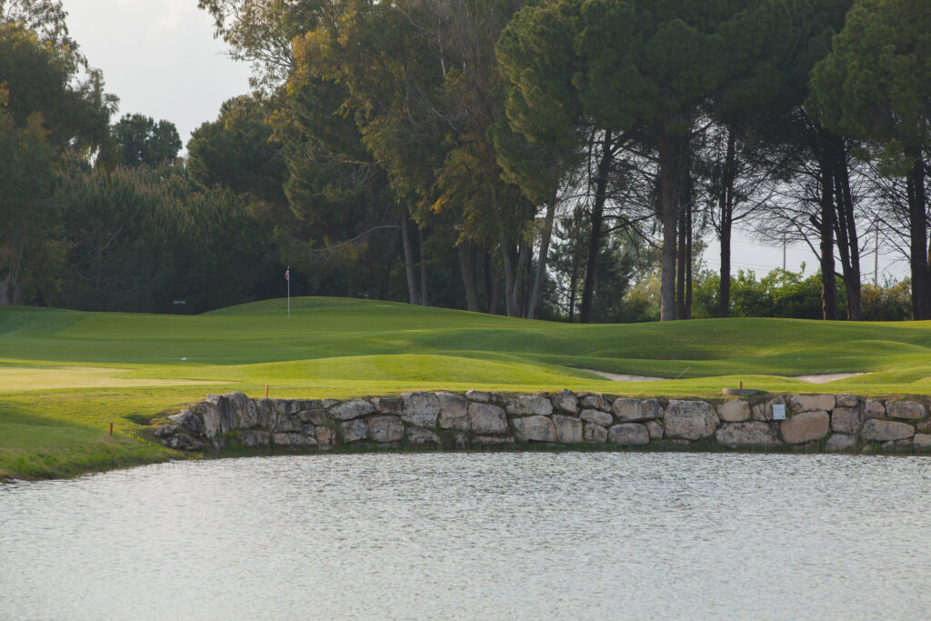 Lake on fairway with trees in background at The Pasha Golf Course