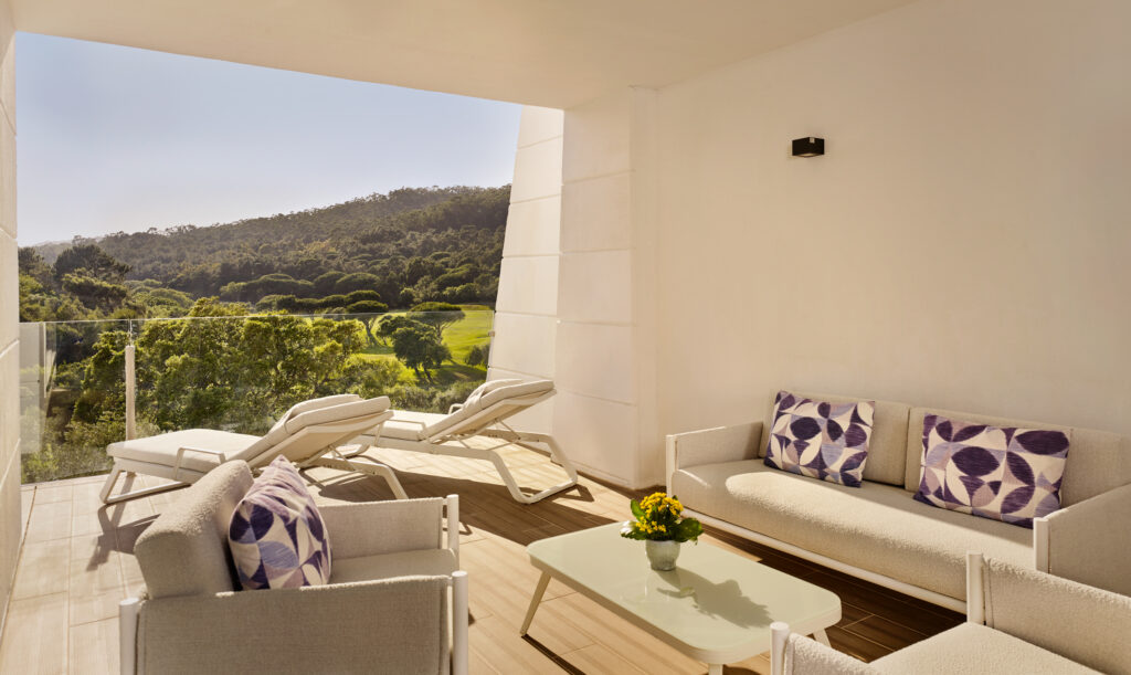 Accommodation seating area with balcony at Penha Longa Resort