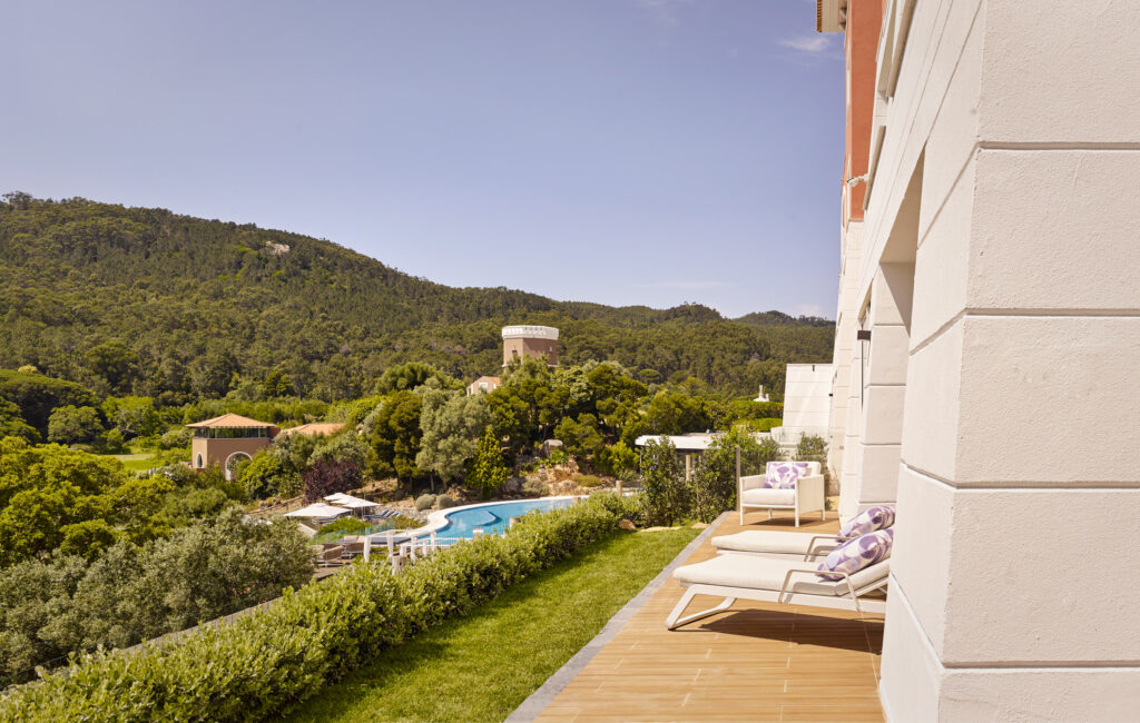 Outdoor terrace with view of outdoor pool at Penha Longa Resort