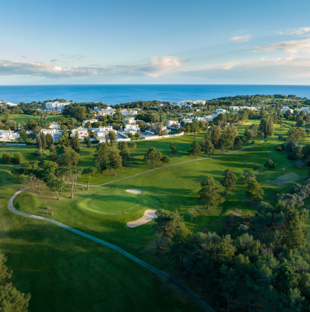 Aerial view of the fairway with bunkers and an ocean view at Alto Golf Course