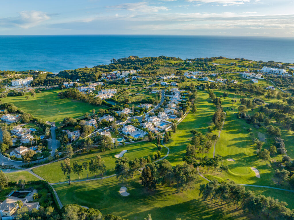 Aerial view of the Alto Golf Course with buildings and ocean view at Alto Golf Course