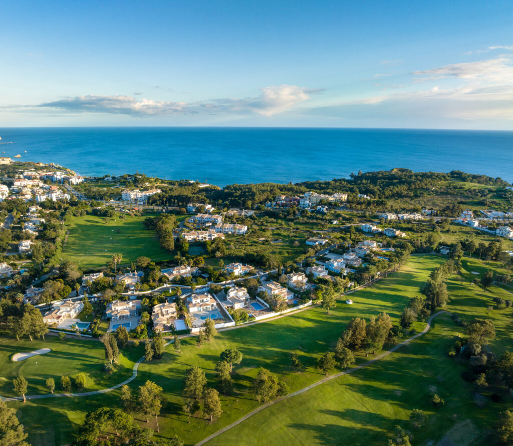 Aerial view of Alto Golf Course with ocean and buildings in background at Alto Golf Course