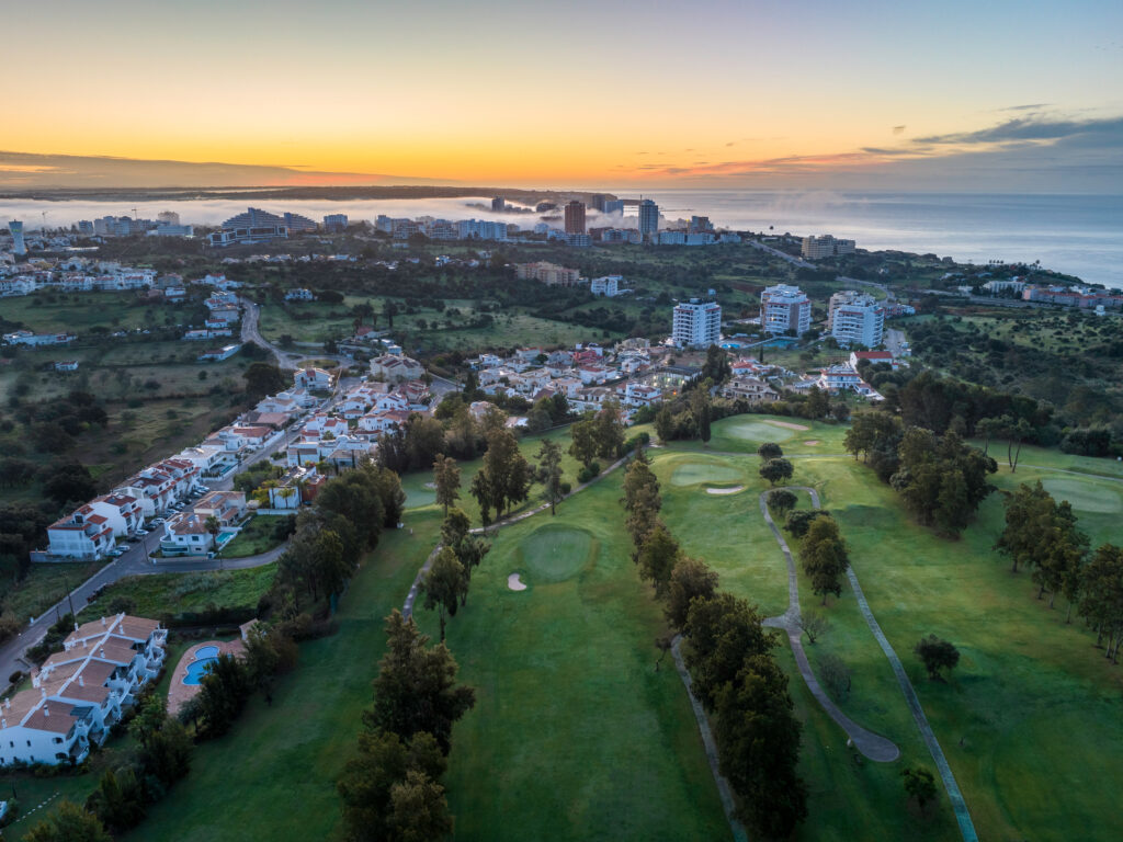 Aerial view of Alto Golf Course with buildings and ocean in background at Alto Golf Course