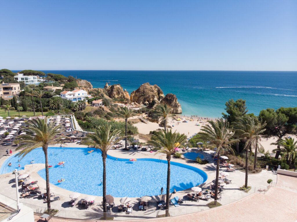 View of outdoor pool with beach view at Pestana Alvor Praia