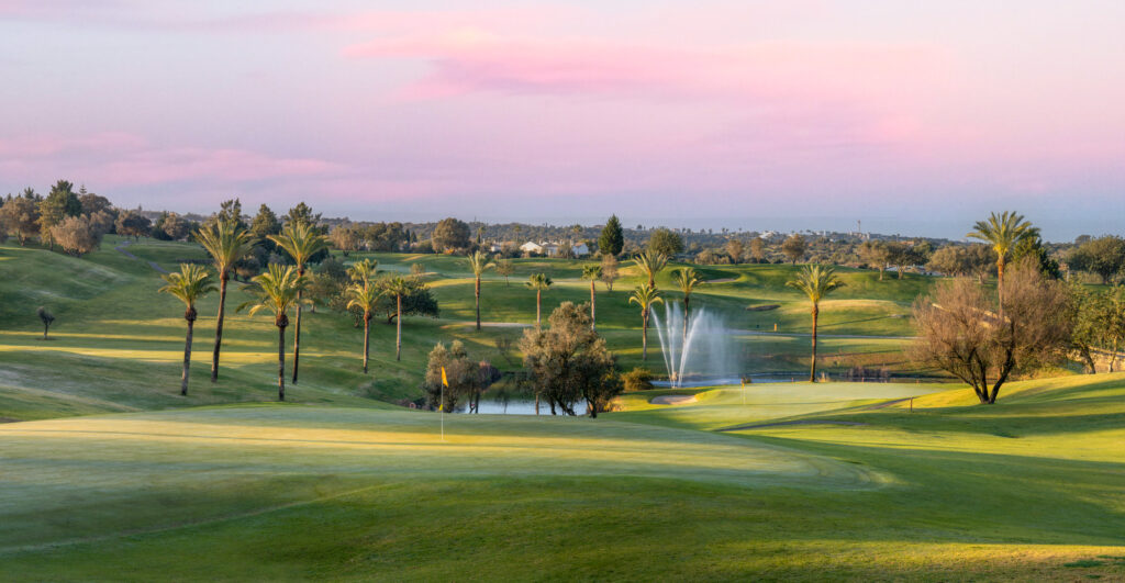 Fairway with a green at sunset at Gramacho Golf Course with sprinkler on