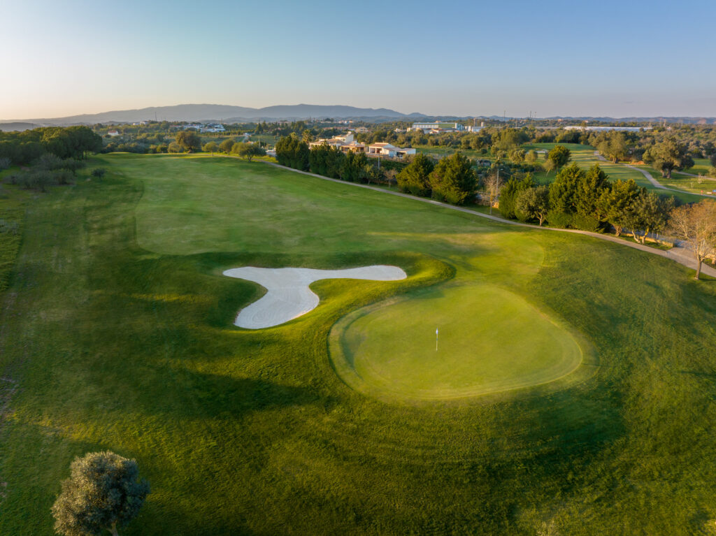 Aerial view of fairway with green and bunker at Silves Golf Course