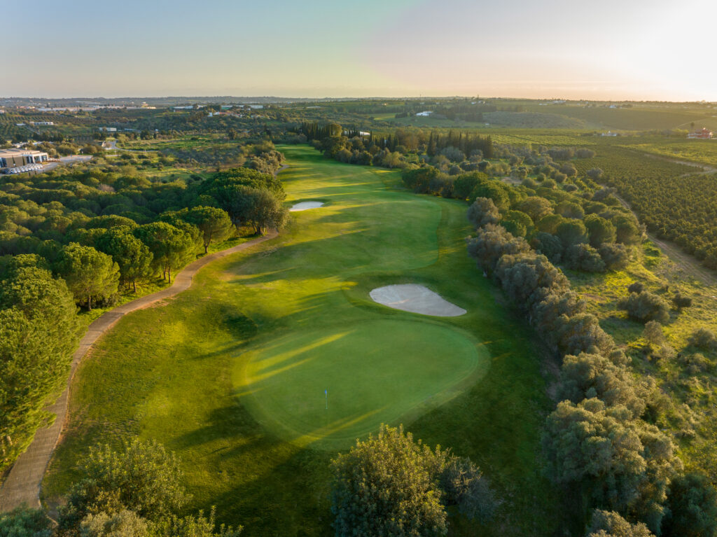 Aerial view of fairway with green and bunker at Silves Golf Course