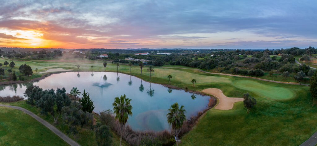 Lake with fairway in background at sunset at Silves Golf Course