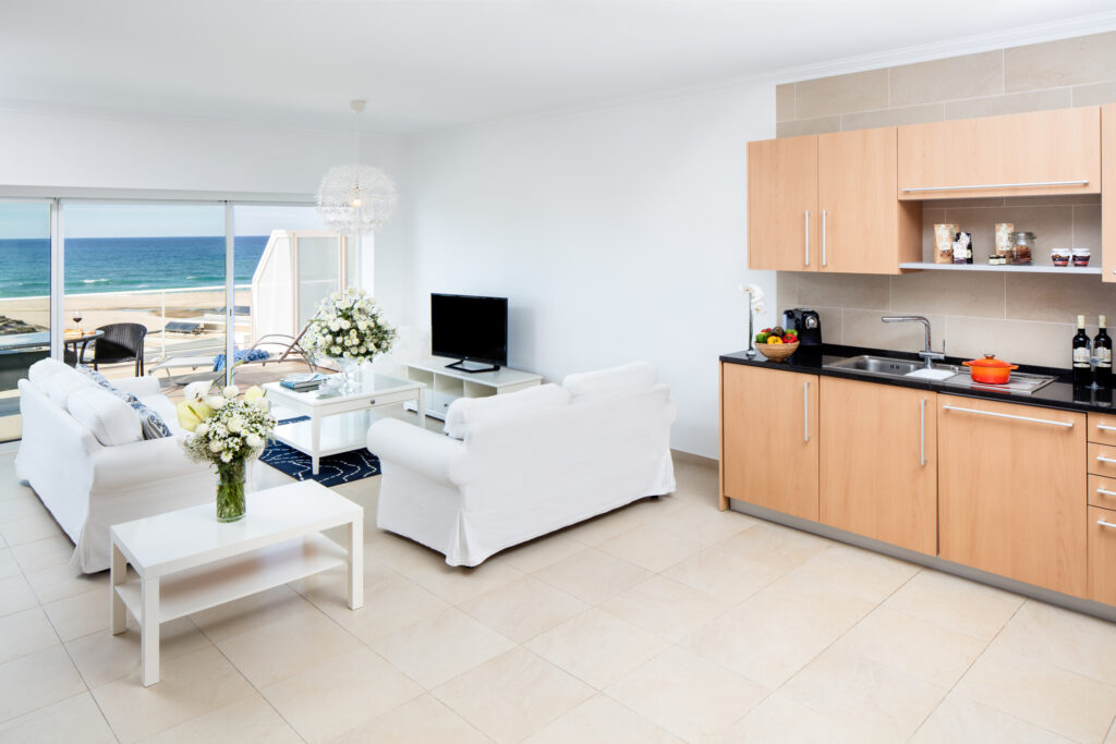 Accommodation living and kitchen area at Praia D'el Rey Golf & Beach Resort