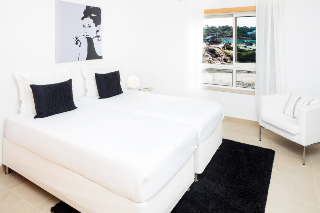 Twin bed accommodation at Praia D'el Rey Golf & Beach Resort