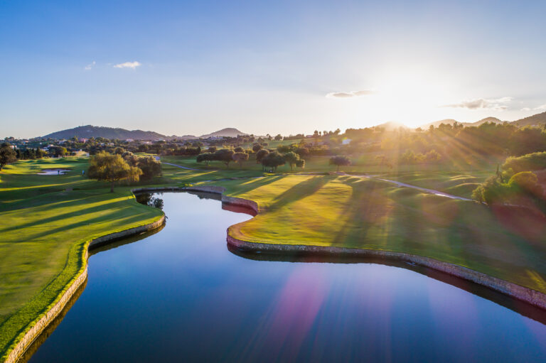 Lake on fairway at Pula Golf Club with trees around