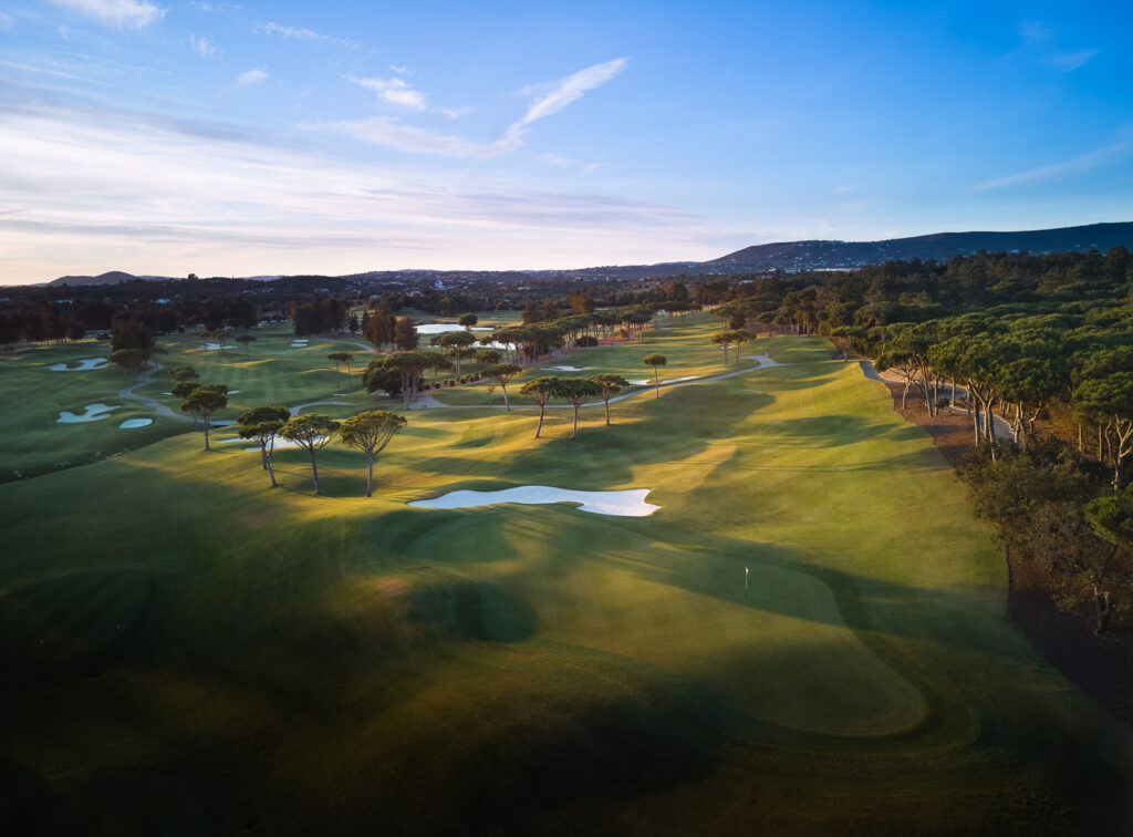 Aerial view of fairway with bunkers and trees at Quinta Do Lago Laranjal Golf Course