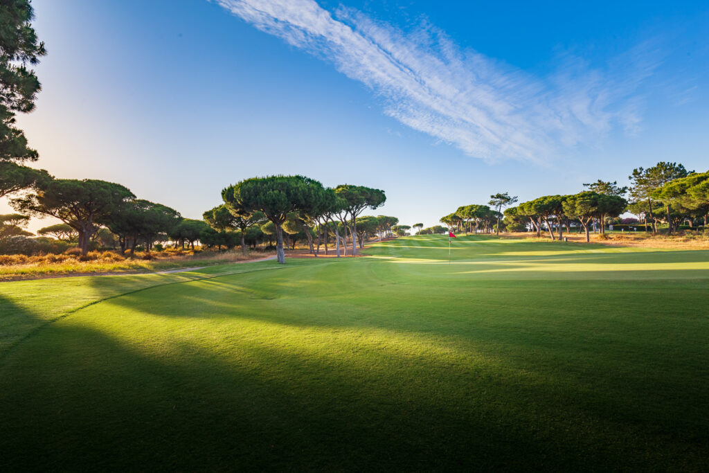 A green with trees around at Quinta Do Lago North Golf Course