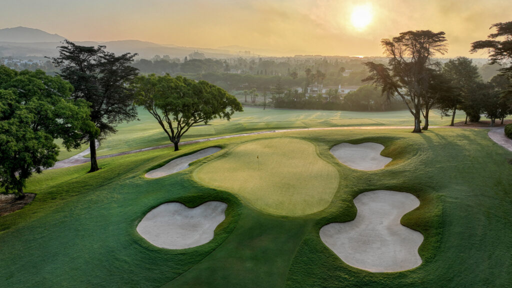 Hole with bunkers and trees at Real Club Valderrama Golf Course