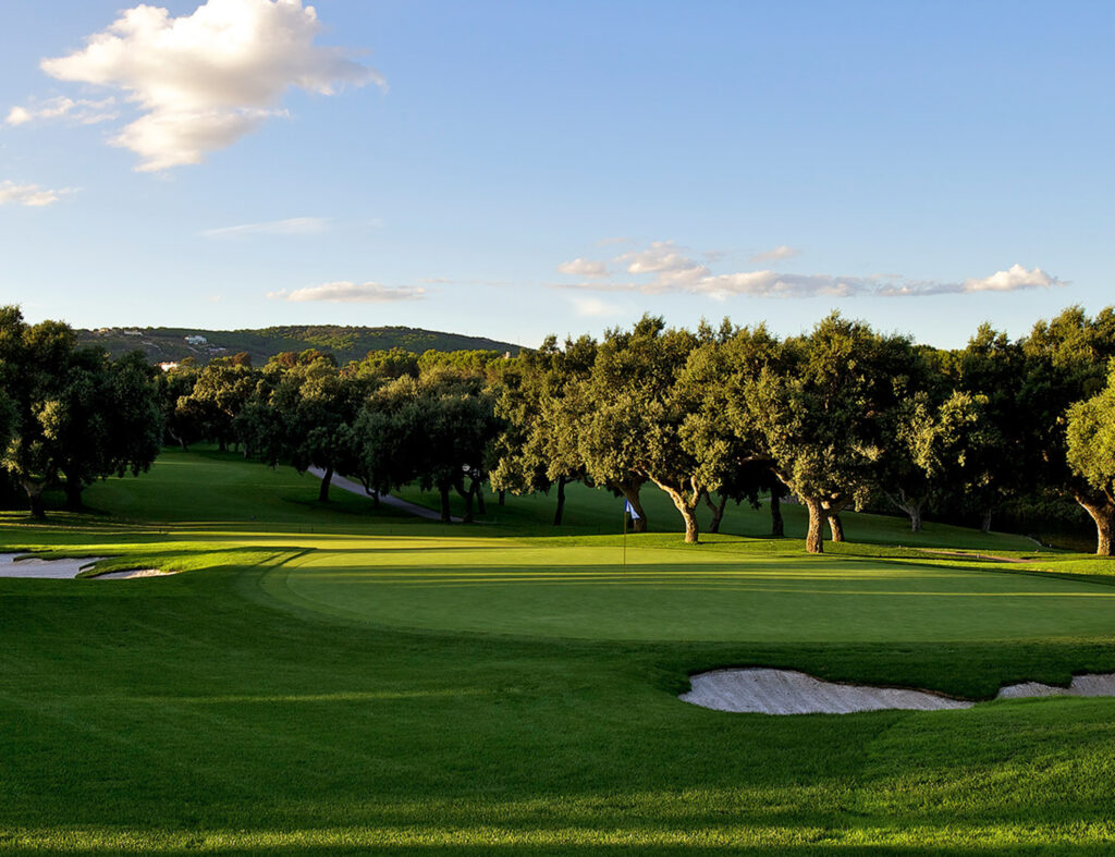 Hole with bunkers and trees around at Real Club Valderrama Golf Course