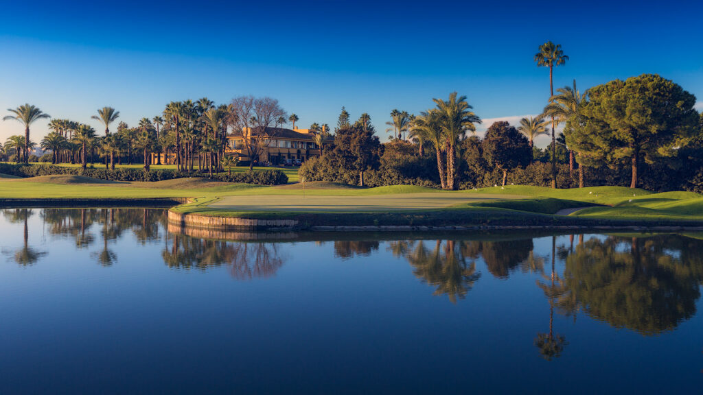 Lake with fairway and trees in background