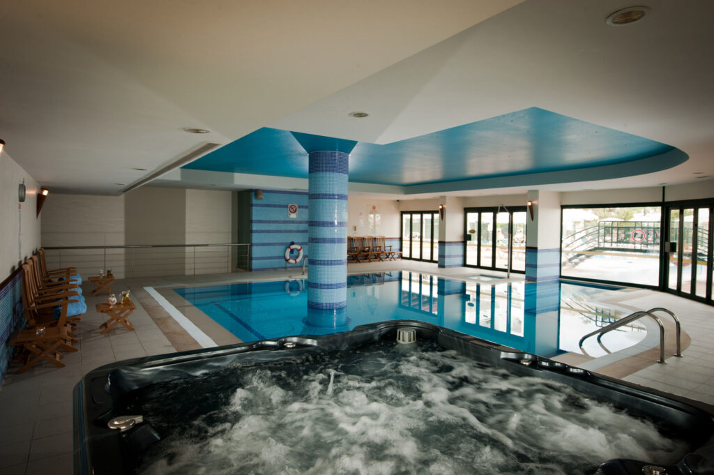 Indoor pool and jacuzzi at Real Bellavista Hotel
