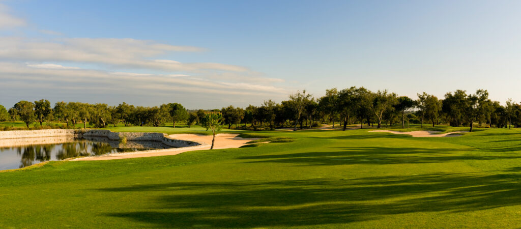 Fairway with bunkers and water hazards with trees in the background at Ribagolfe Lakes Golf Course