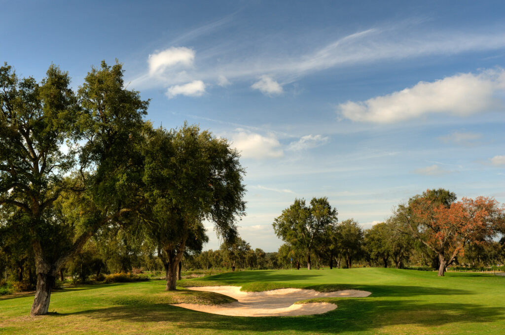 Bunkers and trees on fairway at Ribagolfe Lakes Golf Course