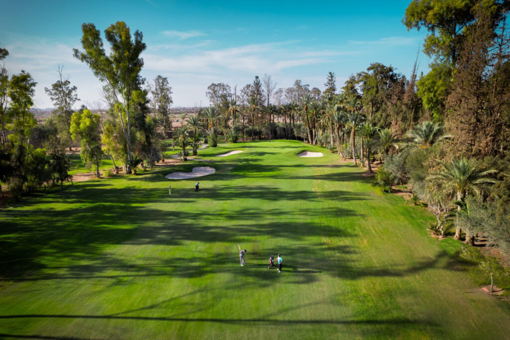 Aerial view of fairway at Royal Golf Marrakech with trees around