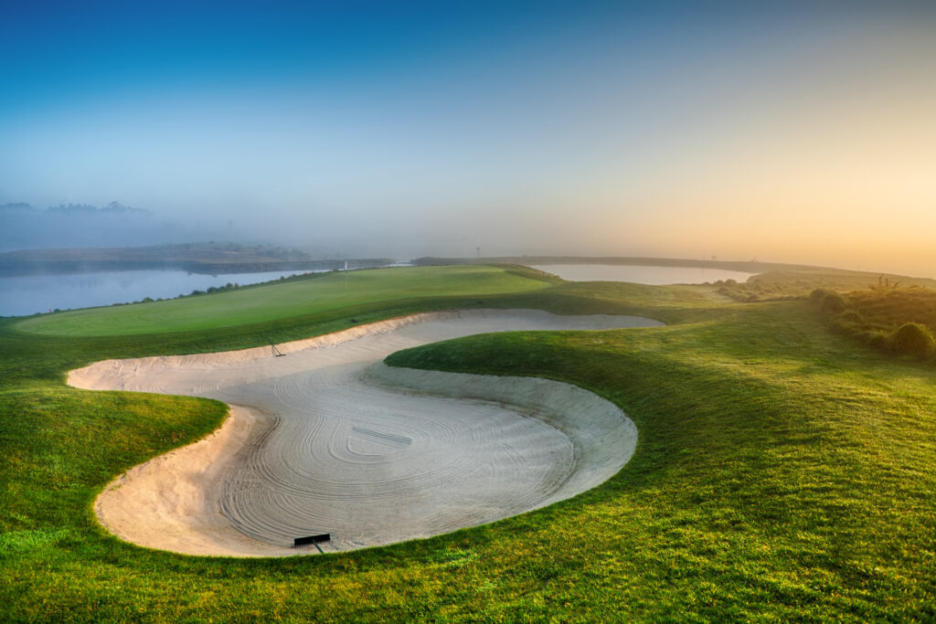 Bunker on the fairway with fog over the course at Royal Obidos Golf Course