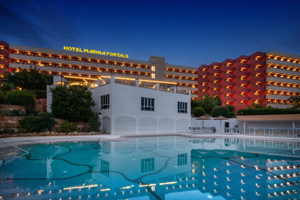 Outdoor pool and exterior of hotel at Salles Hotel Marina Portals