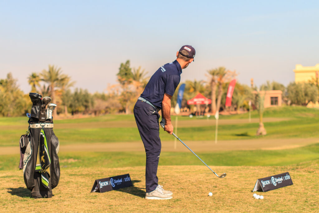 Person playing golf at the driving range at Samanah Golf & Country Club