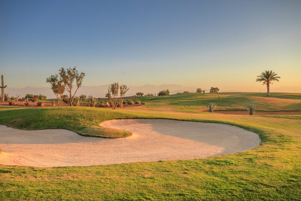 Bunker on fairway at Samanah Golf & Country Club with trees around