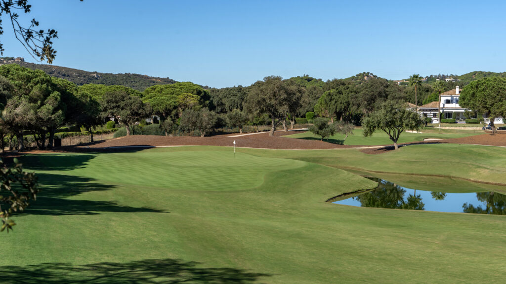 Hole on fairway with trees around at San Roque - The Old Course