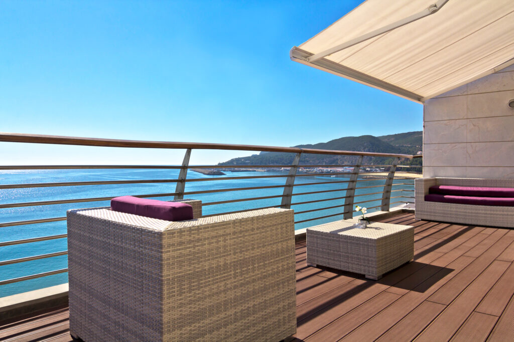 Outdoor deck with seating at Sana Sesimbra Hotel