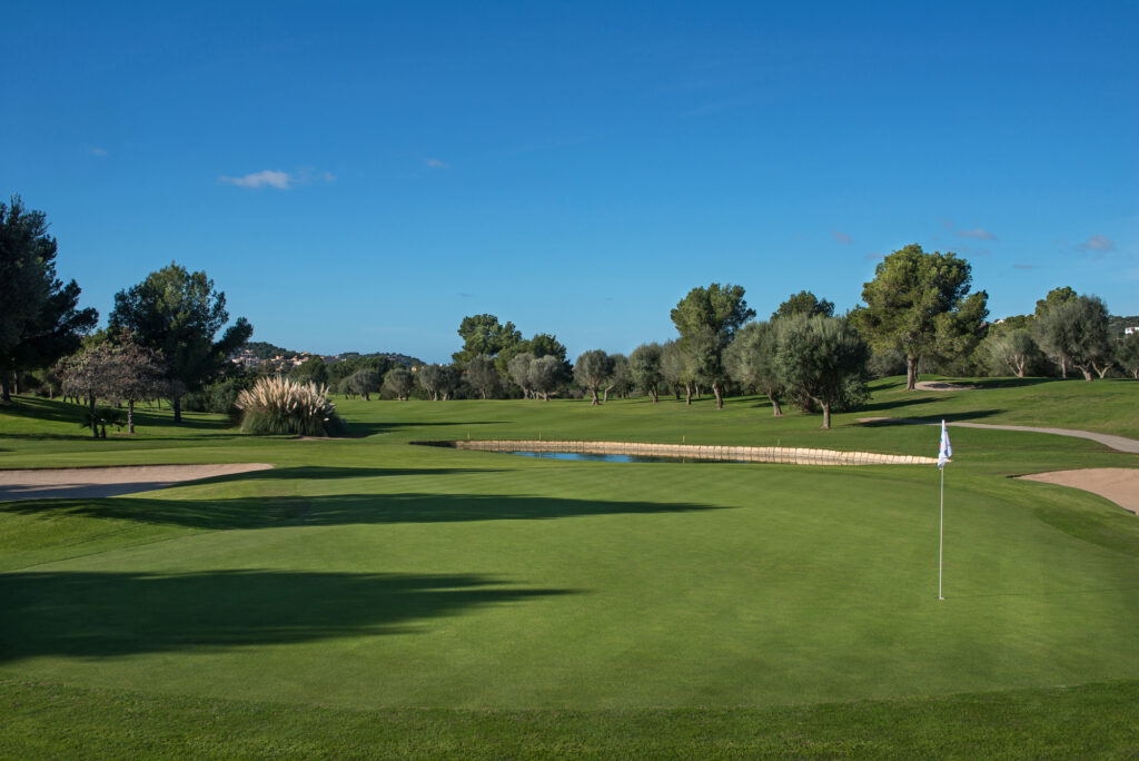 Hole at Santa Ponsa I Golf Course with bunkers and trees around