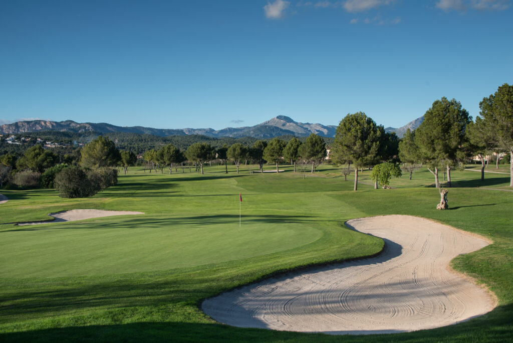 Bunker by a hole with trees in background at Santa Ponsa I Golf Course