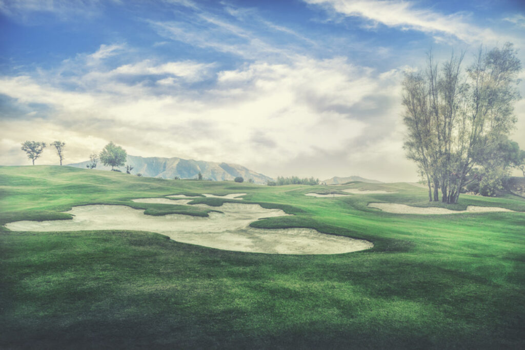 Bunkers on fairway with trees around at Santana Golf Course