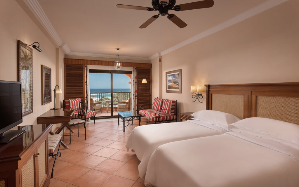 Sheraton Fuerteventura Beach Golf and Spa Resort bedroom with a sea view