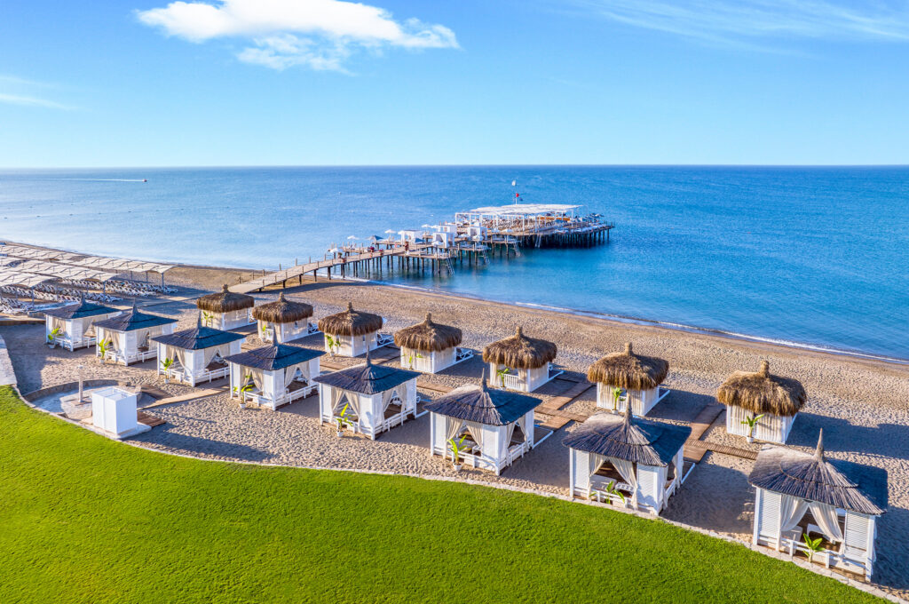 Beach with day beds and loungers at Sirene Belek Hotel