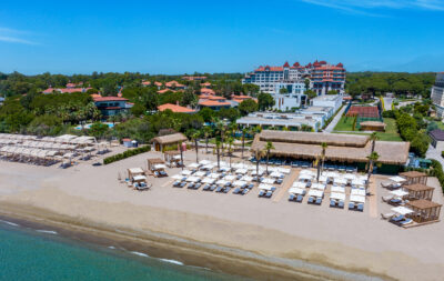 Beach with sun loungers at exterior of Sirene Belek Hotel