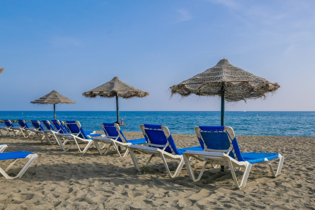 Beach with sun loungers at Sol Marbella Estepona Atalaya Park