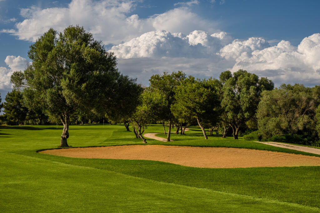 Bunker on fairway with trees around at Son Antem - East Course