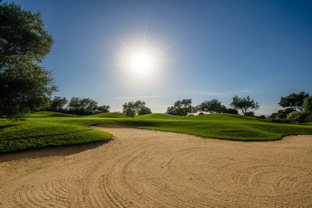 Bunker on fairway with trees around at Son Antem - West Course