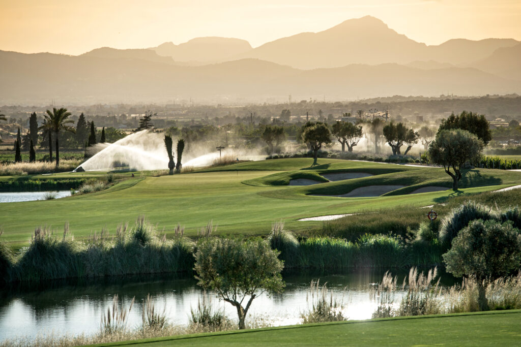 Lake on fairway with bunkers and sprinklers at Son Gual Golf Course