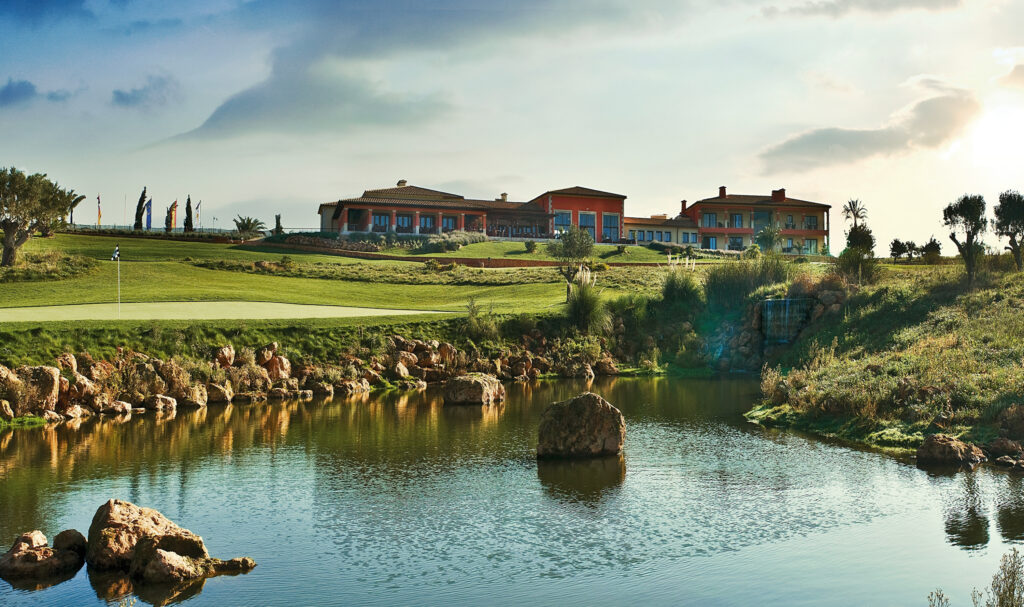 Lake with building in background at Son Gual Golf Course