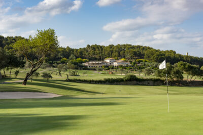 A hole at Son Muntaner Golf Course with trees in background