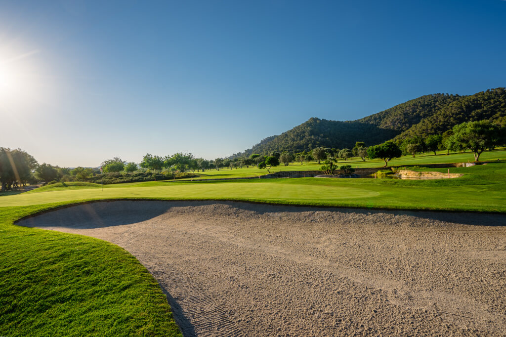 Bunker on fairway with hills in background at Son Servera Golf Course