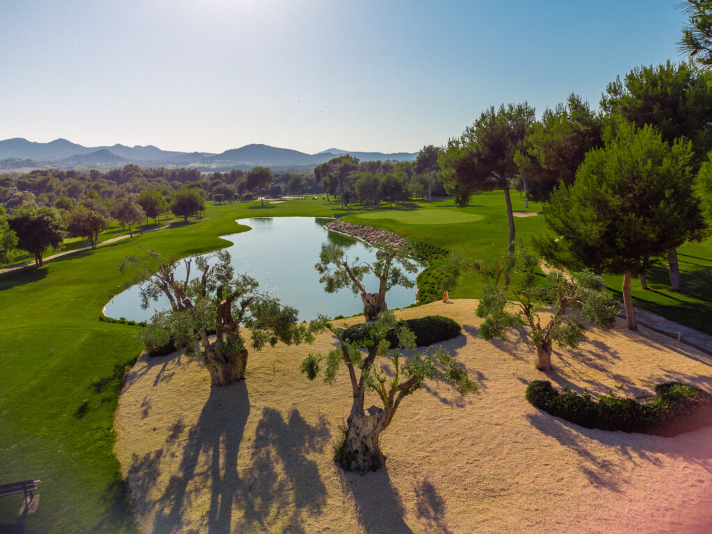 Lake with bunker on fairway with trees around at Son Servera Golf Course