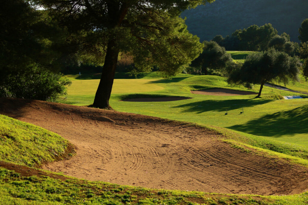 Bunker on fairway with trees around at Son Termes Golf Course