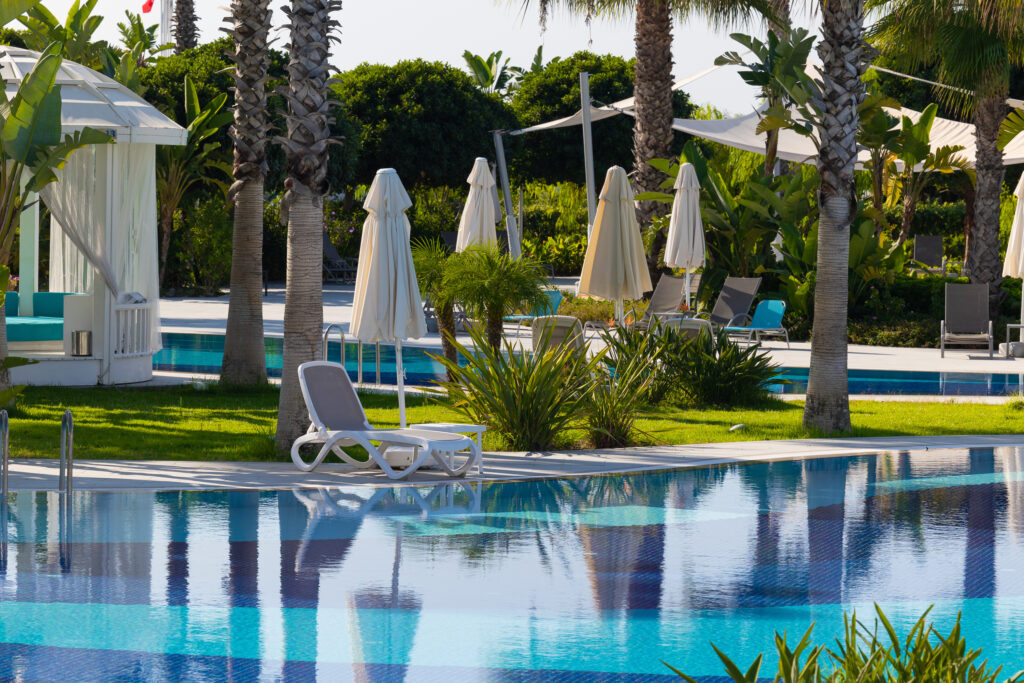 Outdoor pool with loungers at Sueno Hotels Deluxe Belek