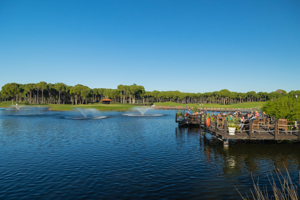 Lake at Sueno Hotels Golf Belek with trees in background