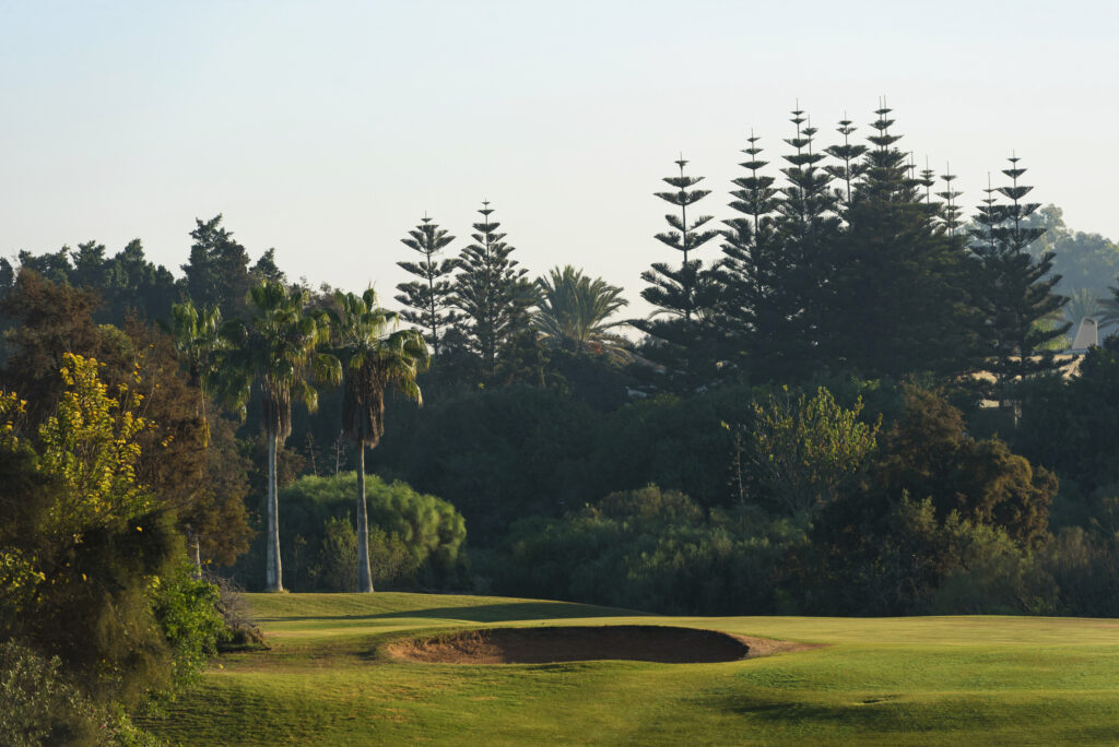 Bunker on fairway at Golf Taghazout with trees around