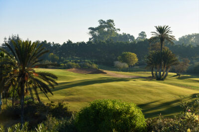 Fairway with bunker at Golf Taghazout with trees around